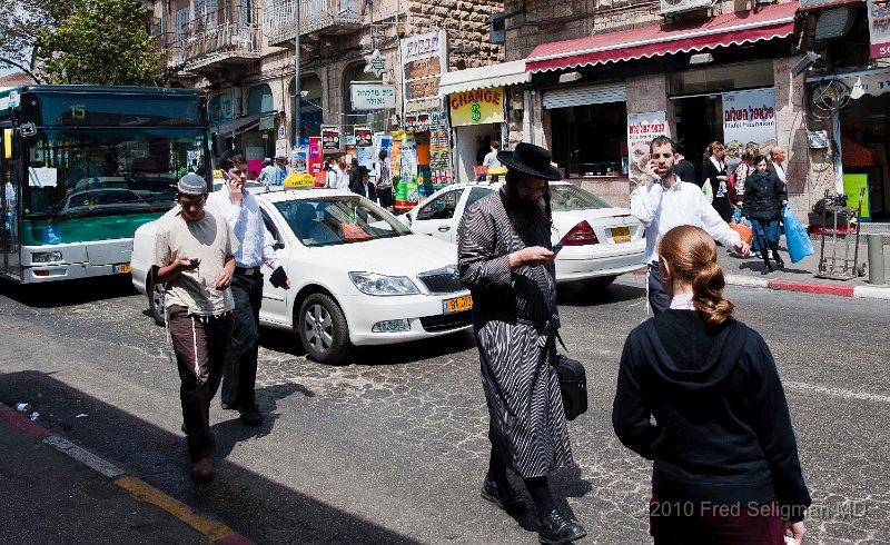 20100409_115545 D3.jpg - Crossing the street while talking on the phone appears to be a sport in Mea Shearim